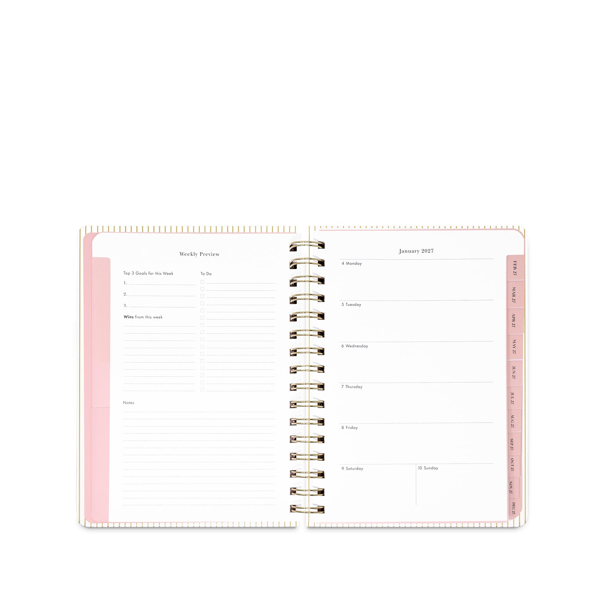 An open spiral-bound planner showing lined daily and weekly planning pages with pale pink accents on a white background.