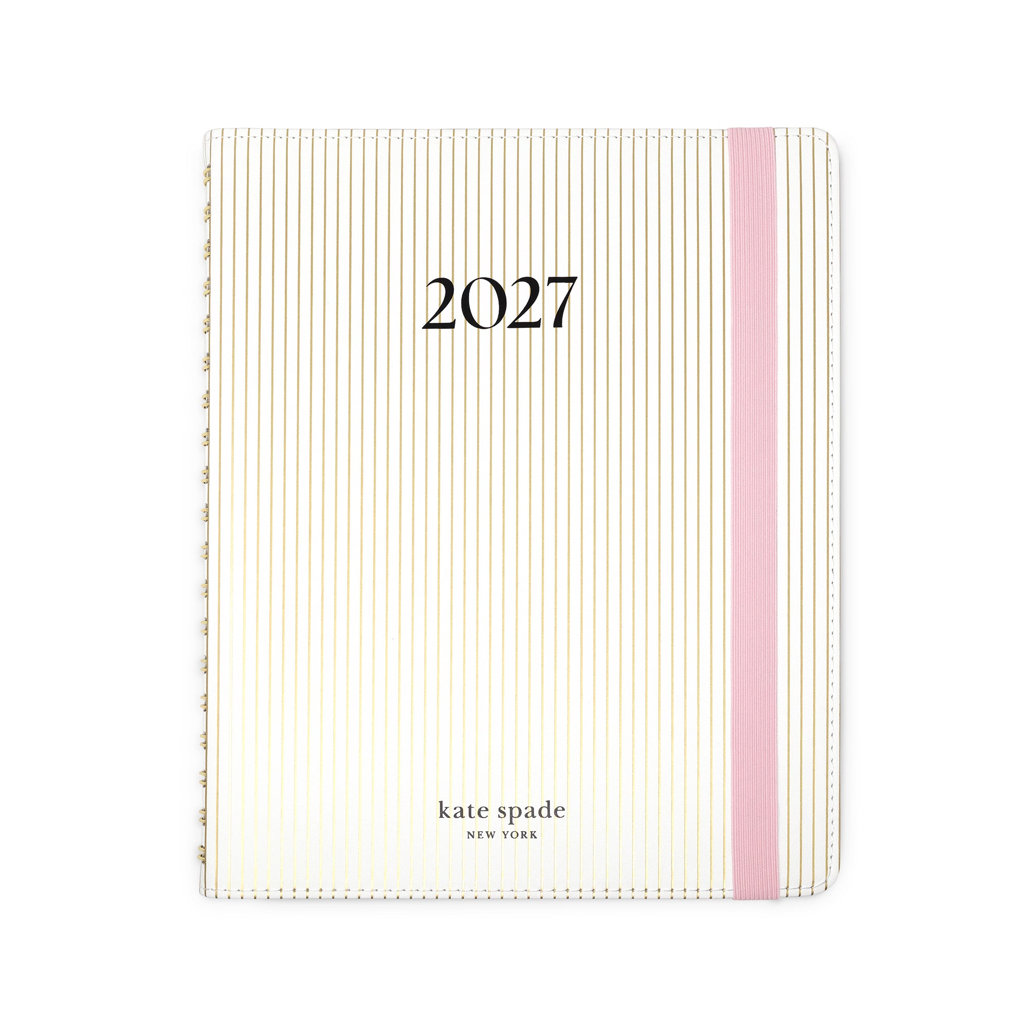 Kate Spade 2027 planner with a cream and gold striped cover, a pink elastic band, and black text on a white background.