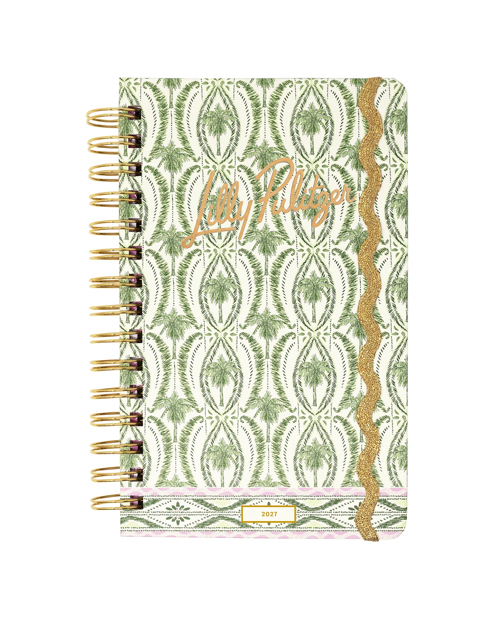 A spiral-bound planner with a green and white palm tree patterned cover, featuring a gold glitter vertical stripe and the cursive brand name 'Lilly Pulitzer' in gold foil on the front.