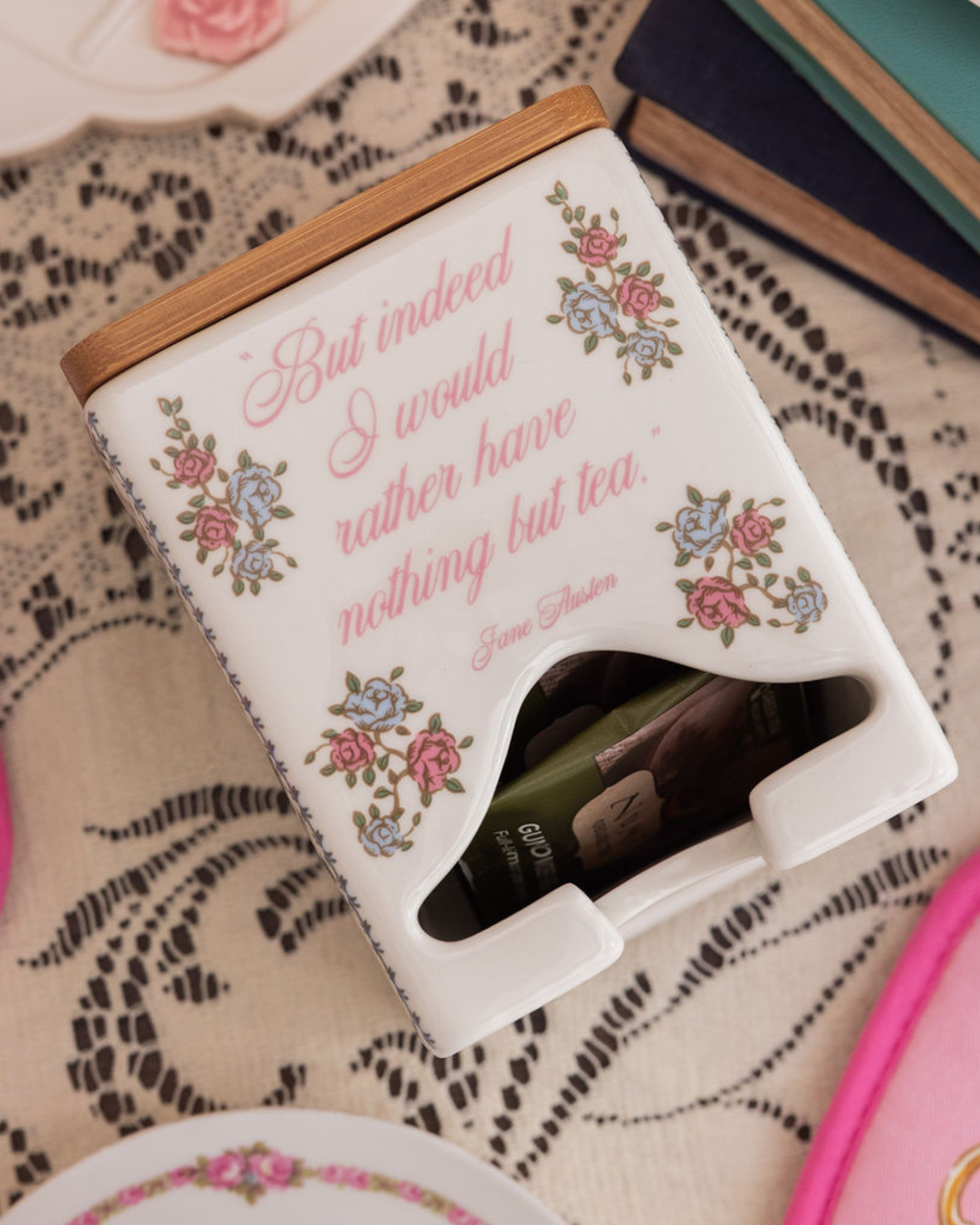 Tea bag holder with floral design and quote on a lace tablecloth