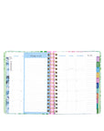 Multicolored planner with various sections on a white background