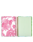 planner with pink floral and green striped design on a white background