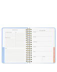 Open planner with weekly schedule and notes section on a white background