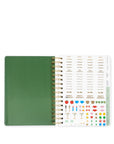 Green notebook with a spiral binding and decorative page on a white background