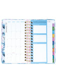Planner with monthly layout and colorful tabs on a white background