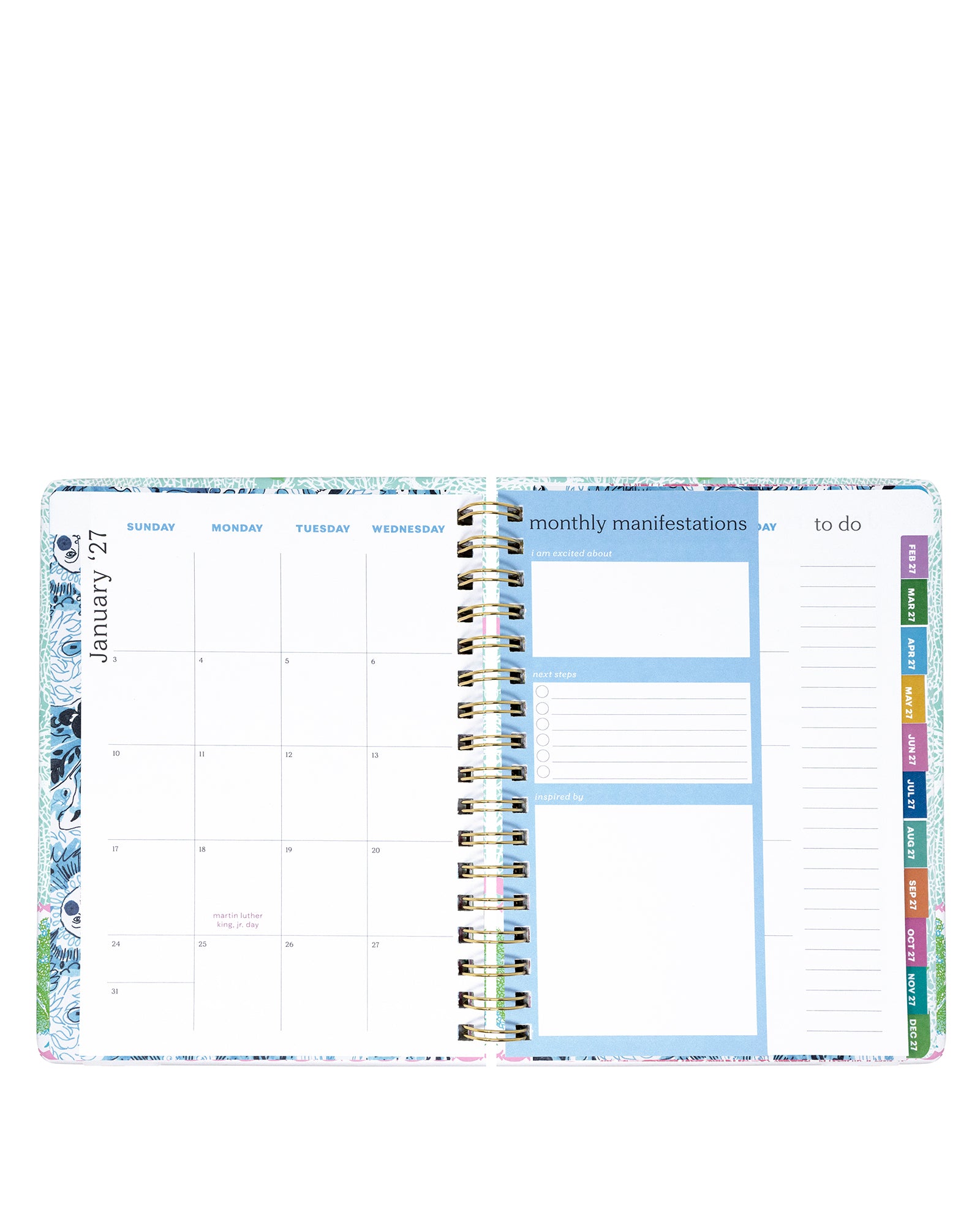 Planner with monthly layout and colorful tabs on a white background