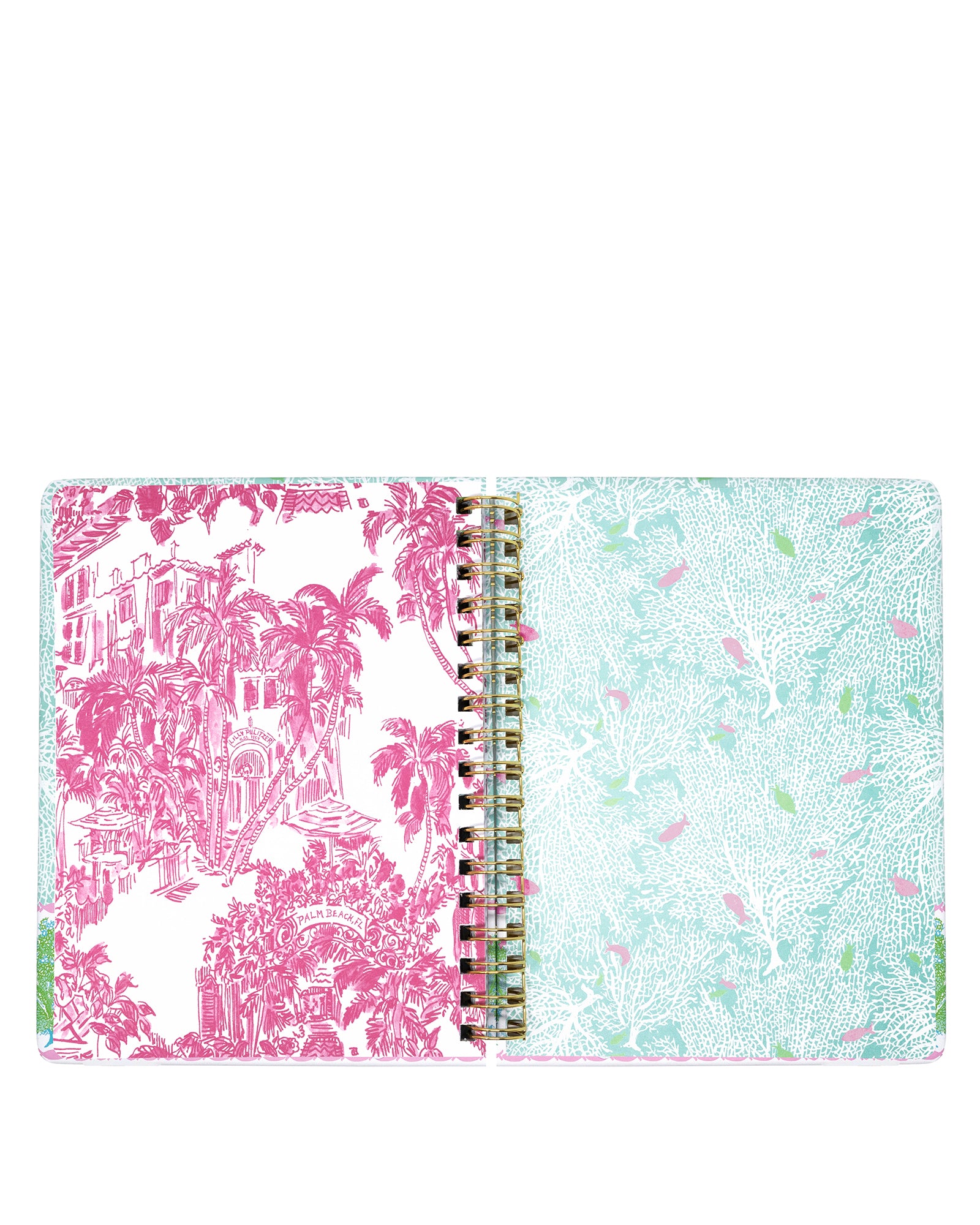 Open planner with pink and white palm tree design on one page and light blue and green patterned design on the other, on a white background.