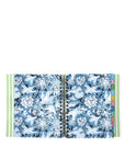 Open planner with blue floral and geometric pattern on a white background