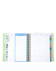 Open planner showing monthly and weekly schedules with colorful tabs on a white background