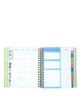Open planner showing monthly layout with colorful tabs on a white background