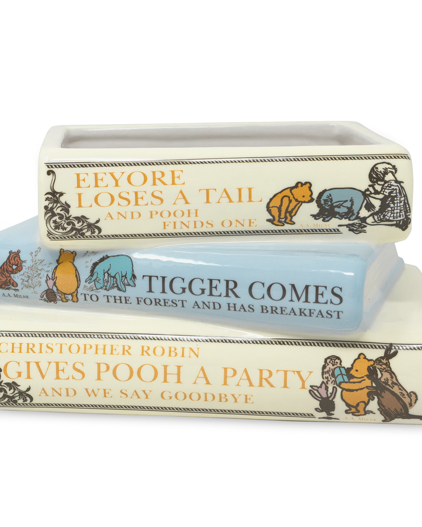 Three books stacked on top of each other with Winnie the Pooh illustrations and text.