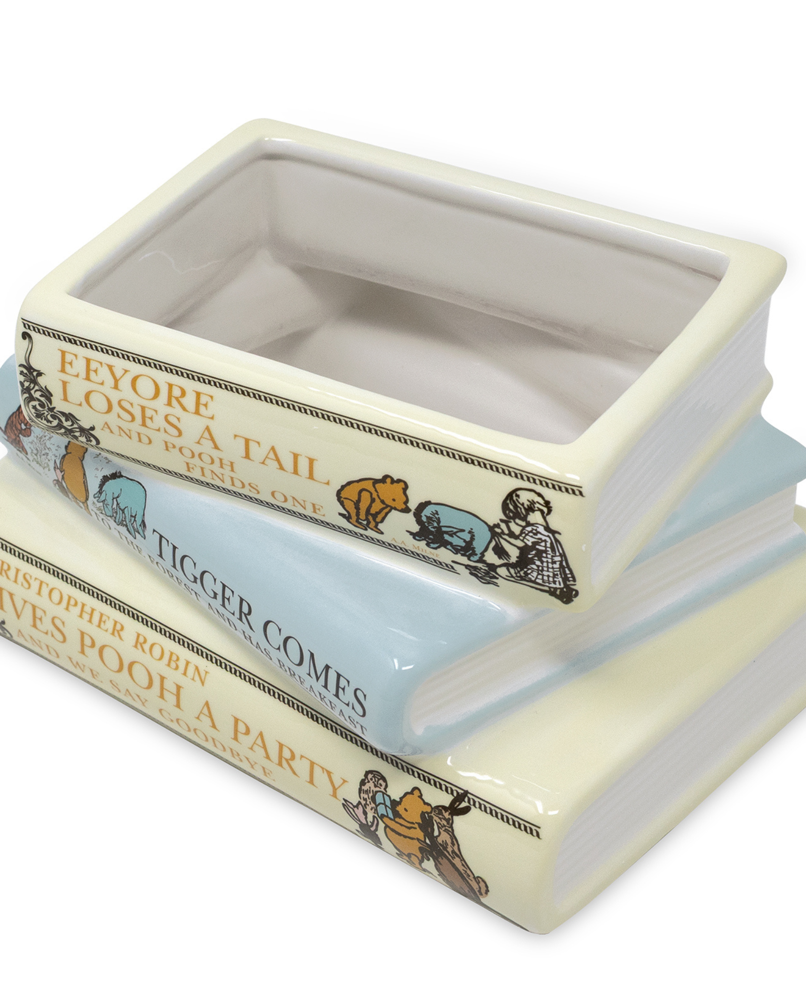 Stack of decorative books with Winnie the Pooh illustrations on a white background