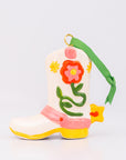 Decorative boot ornament with floral design on a white background