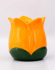 Orange and green ceramic tulip-shaped vase on a white background
