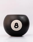 Black billiard ball with number 8 on a white background