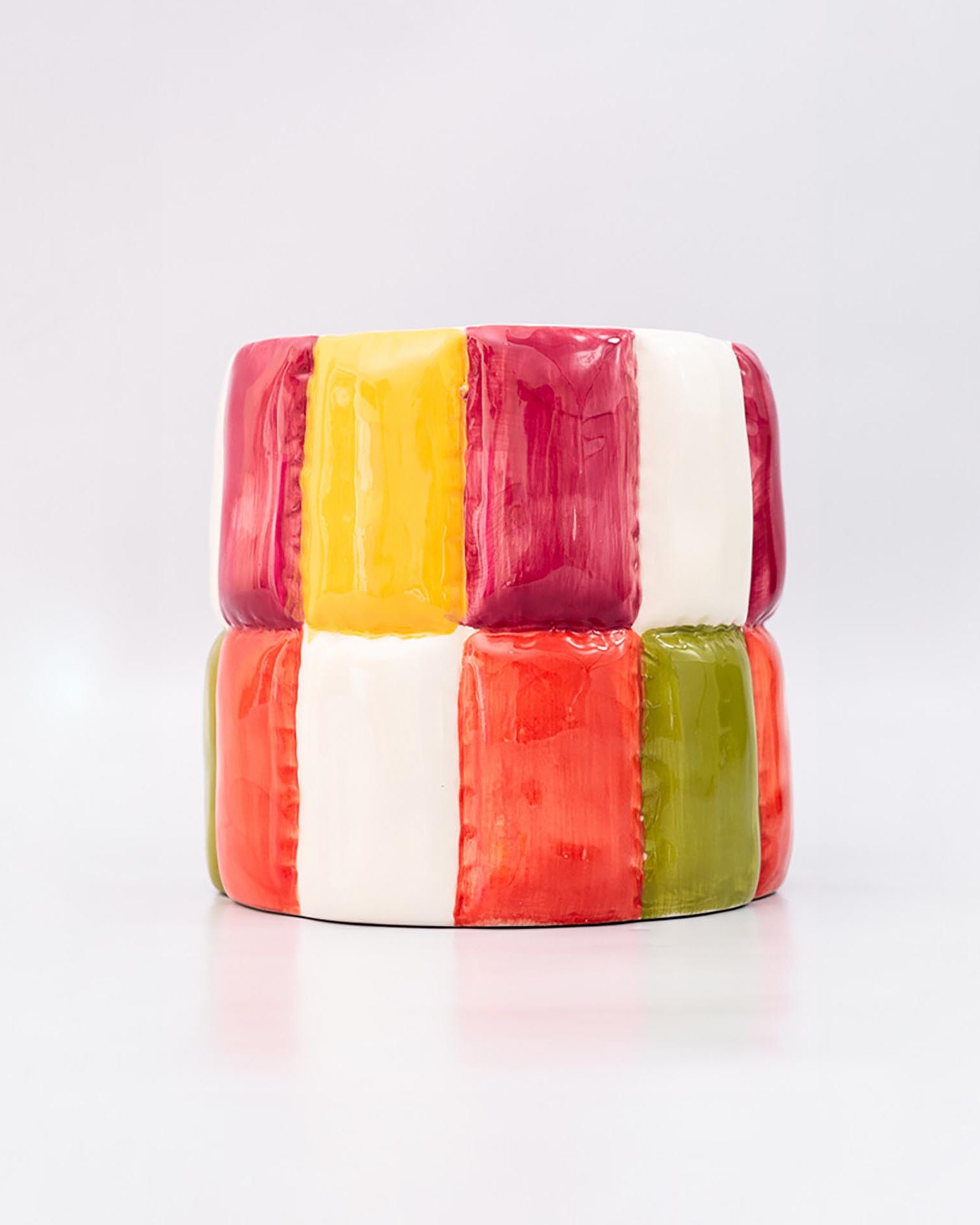 Colorful block-patterned planter on a white background