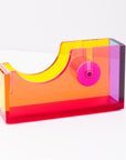 Colorful tape dispenser with pink tape on a white background