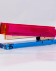 Colorful stapler with pink and blue design on a white background