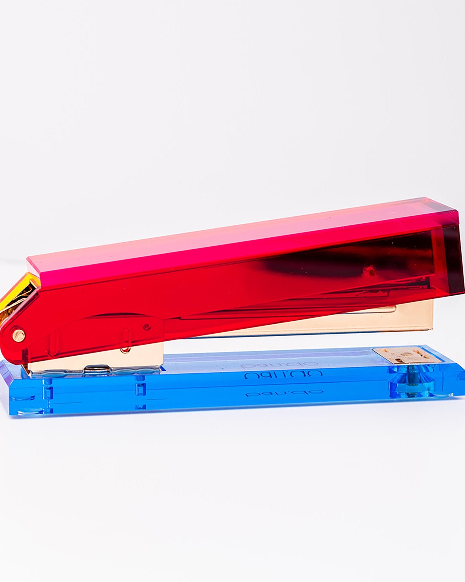 Colorful stapler with red and blue components on a white background
