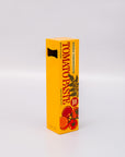 Reverse side of yellow box of tomato paste bottle opener with red tomatoes on a white background