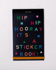 Sticker book cover with colorful text on a black background