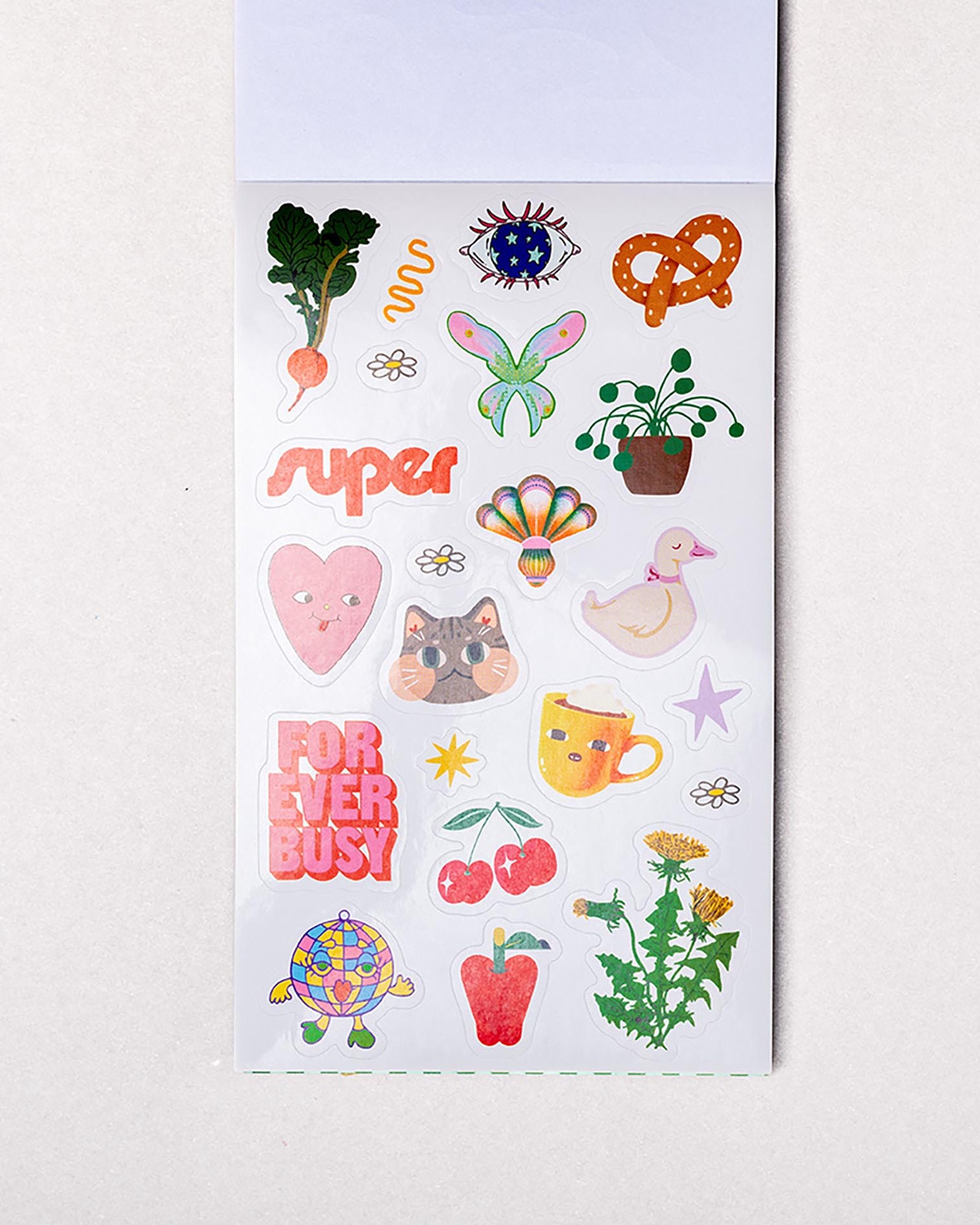 Sheet of colorful stickers with various designs on a white background