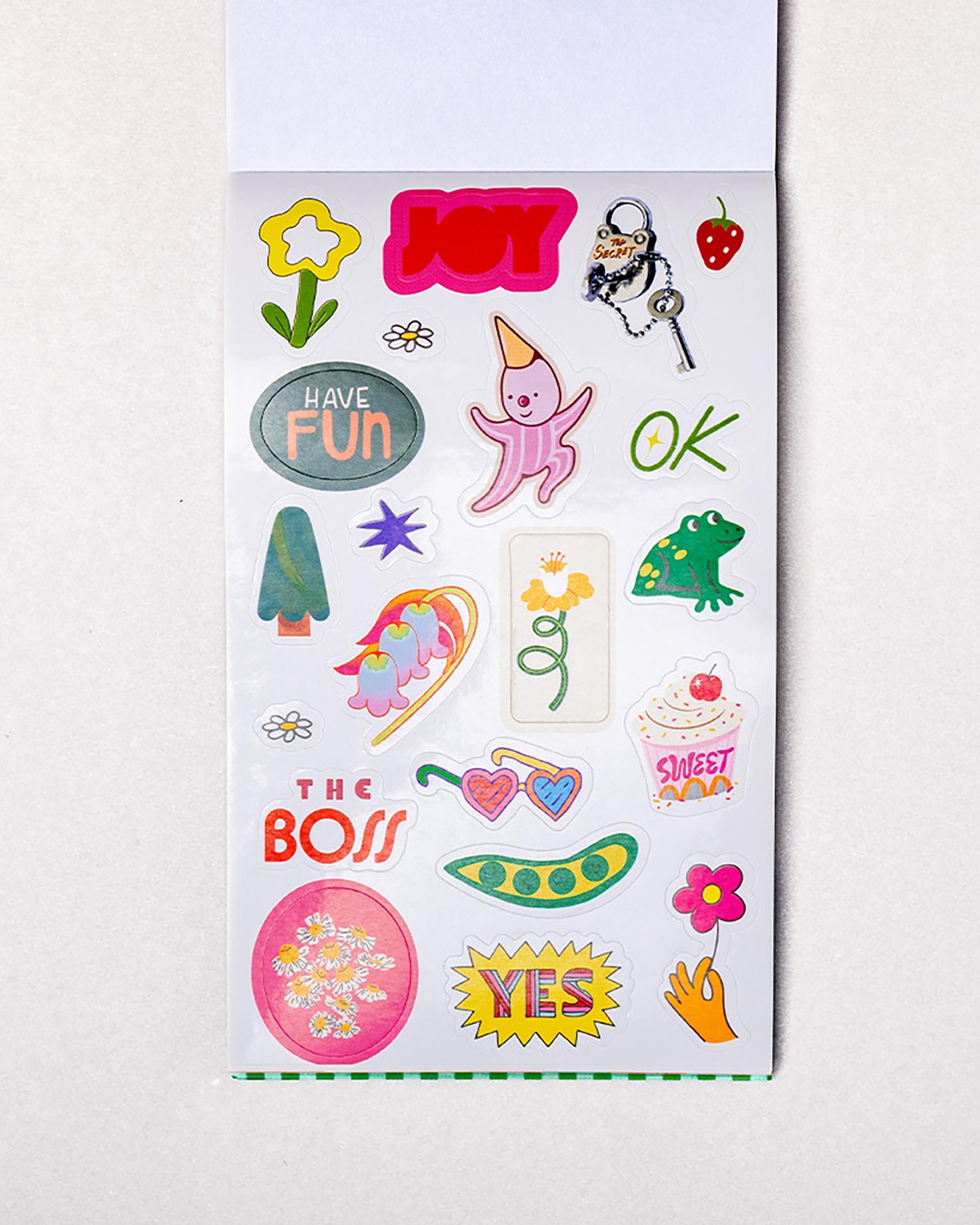 Sheet of colorful stickers with various designs on a white background