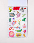 Sheet of colorful stickers with various designs on a white background
