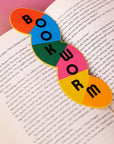 Colorful 'Bookworm' shaped bookmark on an open book