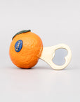 Orange-shaped bottle opener with a heart design on a light gray background