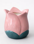 Pink and teal ceramic tulip vase on a white background