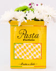 yellow pasta box vase with flowers inside