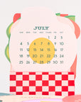 Calendar for July with a colorful design on a white background