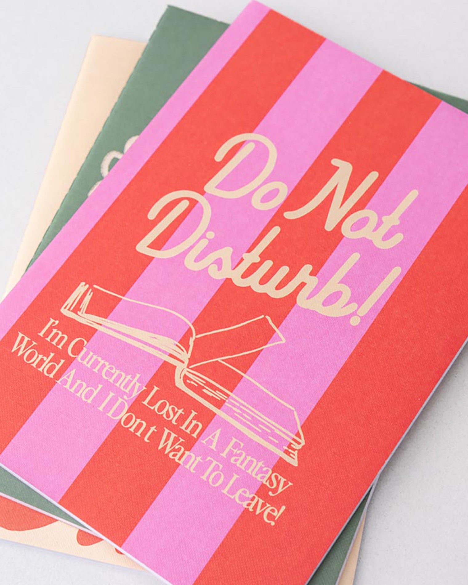 Notebook with 'Do Not Disturb' text and design on a light gray background