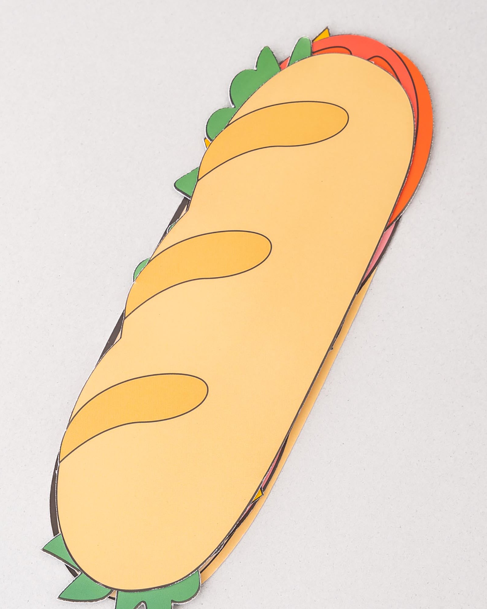 Cartoon-style burrito plush toy on a light gray background
