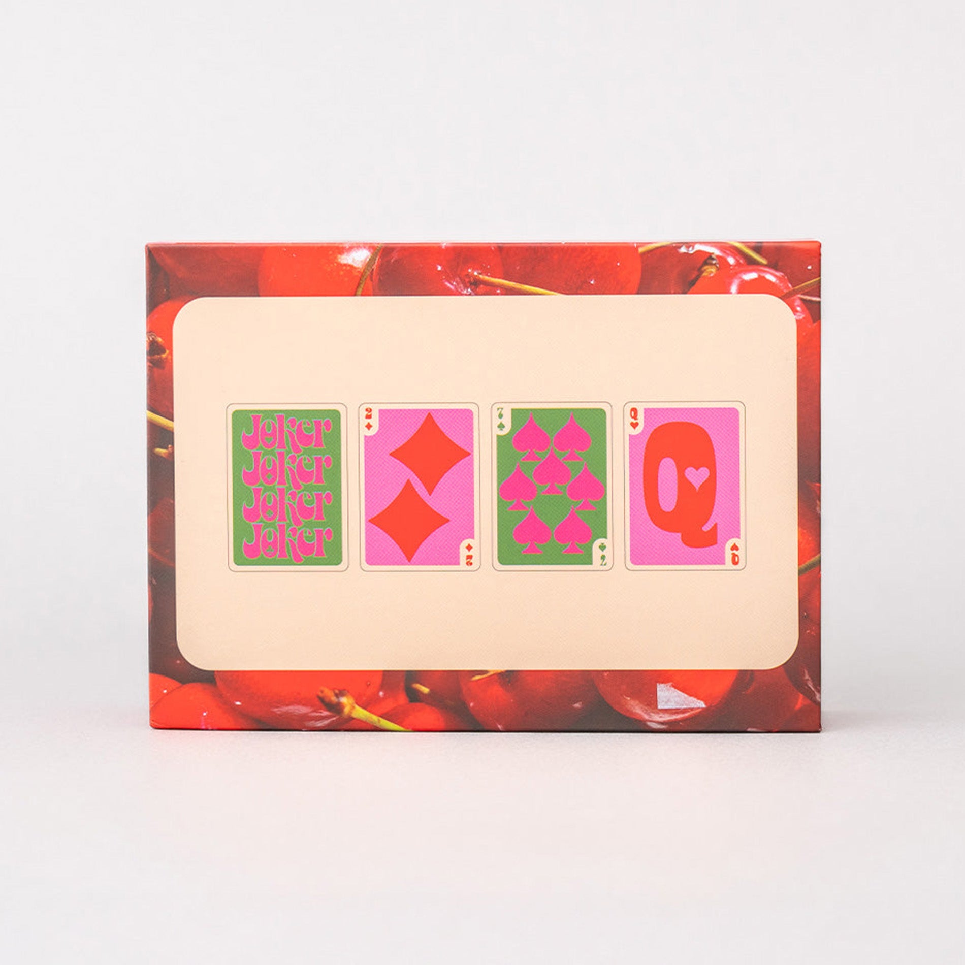 Playing card set with decorative border featuring cherries on a white background