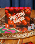 Playing card set with cherry design on a decorative tray