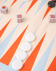 Backgammon board with white pieces, black pieces, and dice on a colorful board