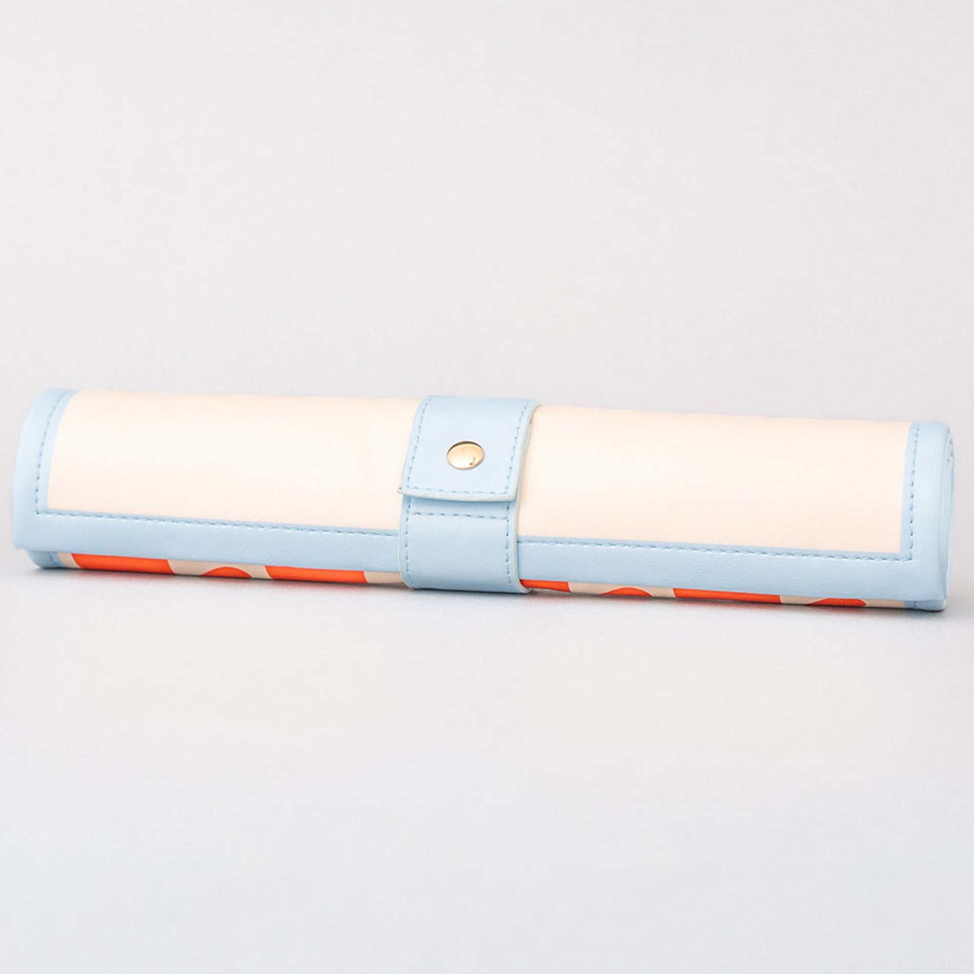roll up checkers and backgammon with light blue border and red pattern on a gray background