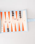 Backgammon board with pieces on a light gray background