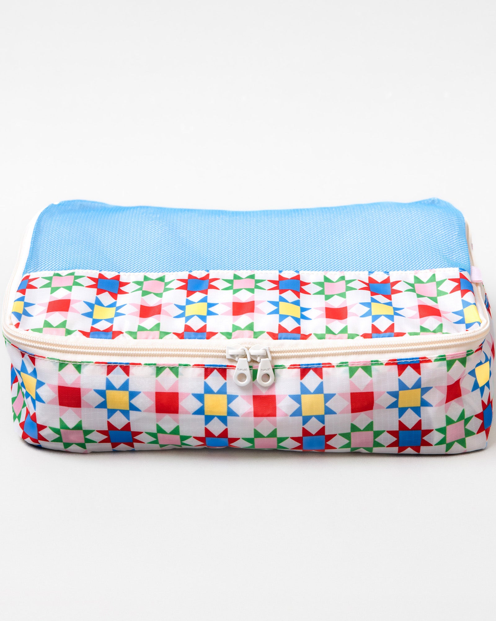 A rectangular zippered pouch with a colorful geometric star pattern on a white background and a light blue mesh top, shown on a plain white studio background.