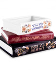Stack of books with 'Pride and Prejudice' on a white background