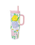 Floral-patterned tumbler with a pink handle and straw on a white background