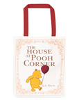 Tote bag with Winnie the Pooh design and 'The House at Pooh Corner' text on a white background