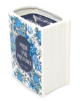 Book-shaped candle with 'Pride and Prejudice' design on a white background