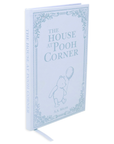 Book titled 'The House at Pooh Corner' with a decorative cover on a white background