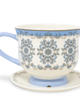 Ceramic cup with decorative blue patterns on a white background