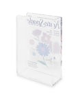 Back view of Kate Spade book vase with colorful flowers on a white background