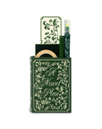 Green book-shaped product with decorative cover on a white background