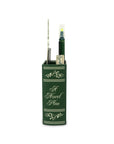 Green book-shaped pen holder with a pen on a white background